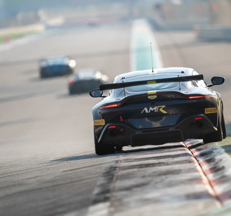 Aston Martin AMR GT4 on track — rear view